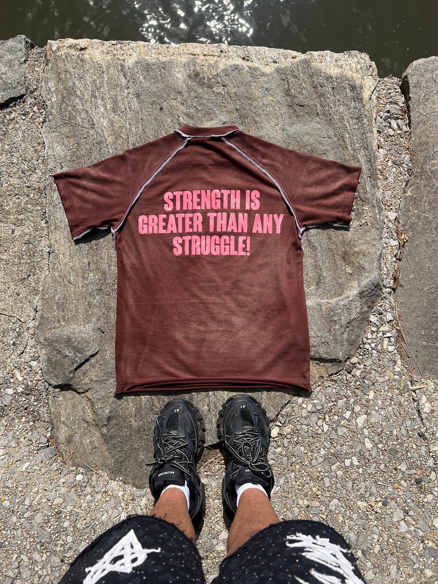 “Strength is great then any struggle” Brown TEE!