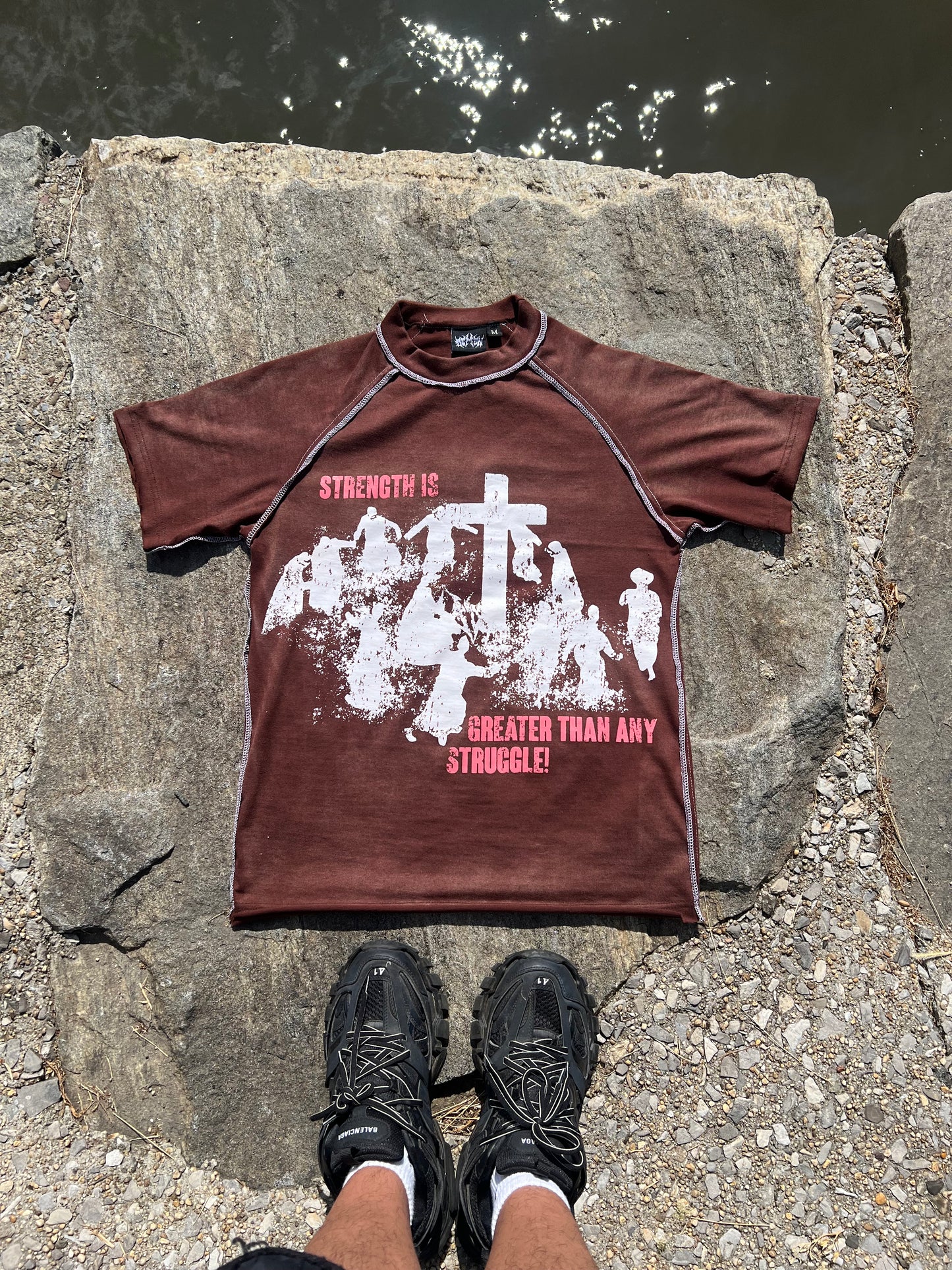 “Strength is great then any struggle” Brown TEE!